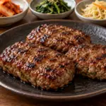 달고 짭짤한 양념을 발라 구운 떡갈비와 밥·쌈채소·반찬